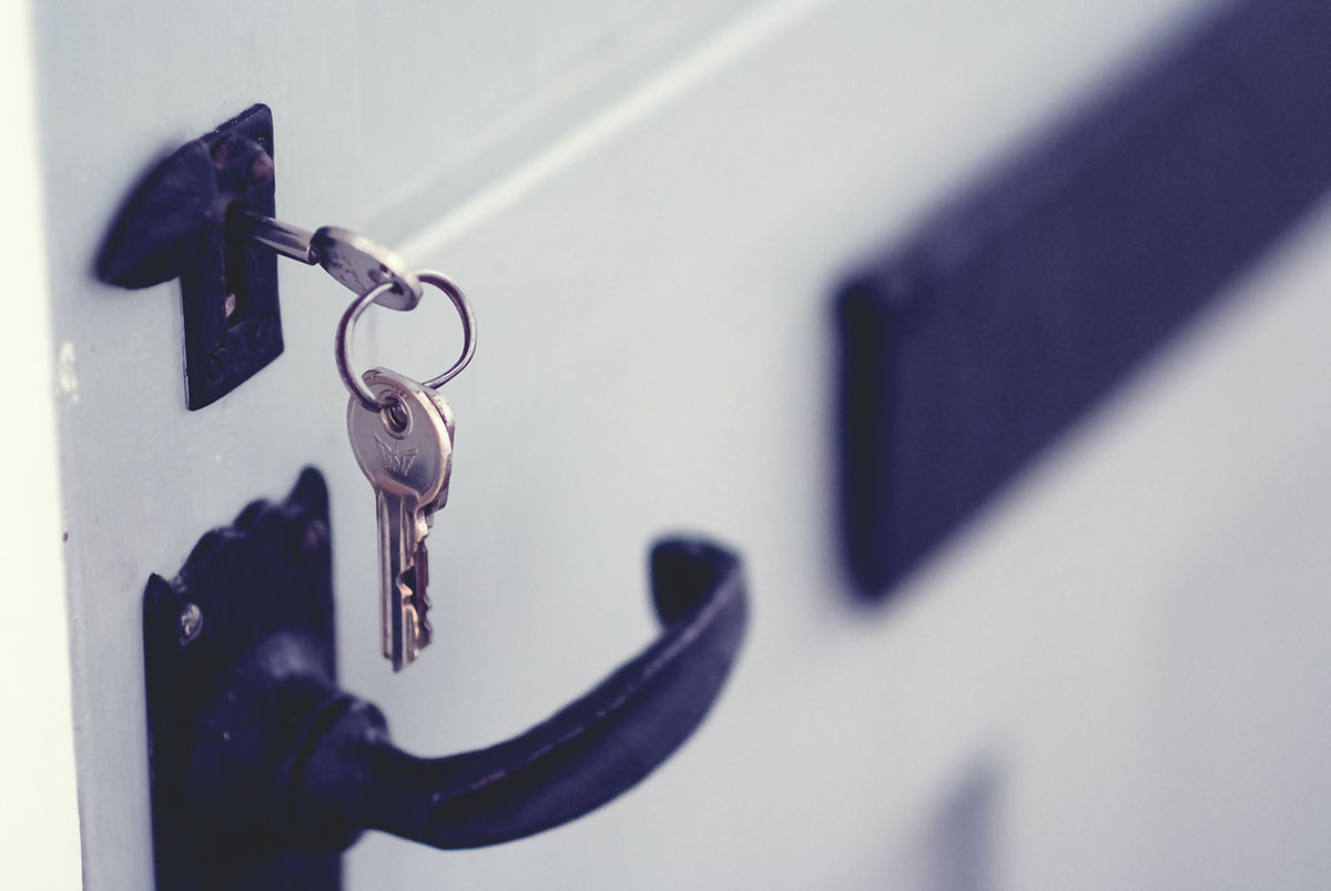 photo of keys in a lock of a door