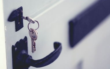 photo of keys in a lock of a door